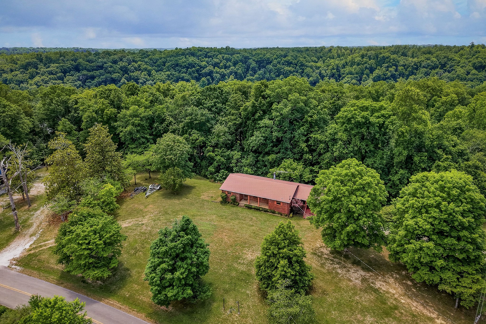 5642 Pates Ford Road Smithville, TN 37166 - Photo 2 of 32 a view of a house with a yard and a yard