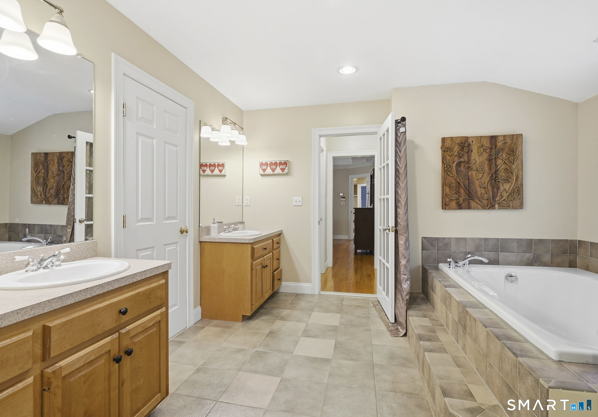 24 Scott Road Oxford, CT 06478 - Photo 20 of 39 a spacious bathroom with a tub sink and mirror