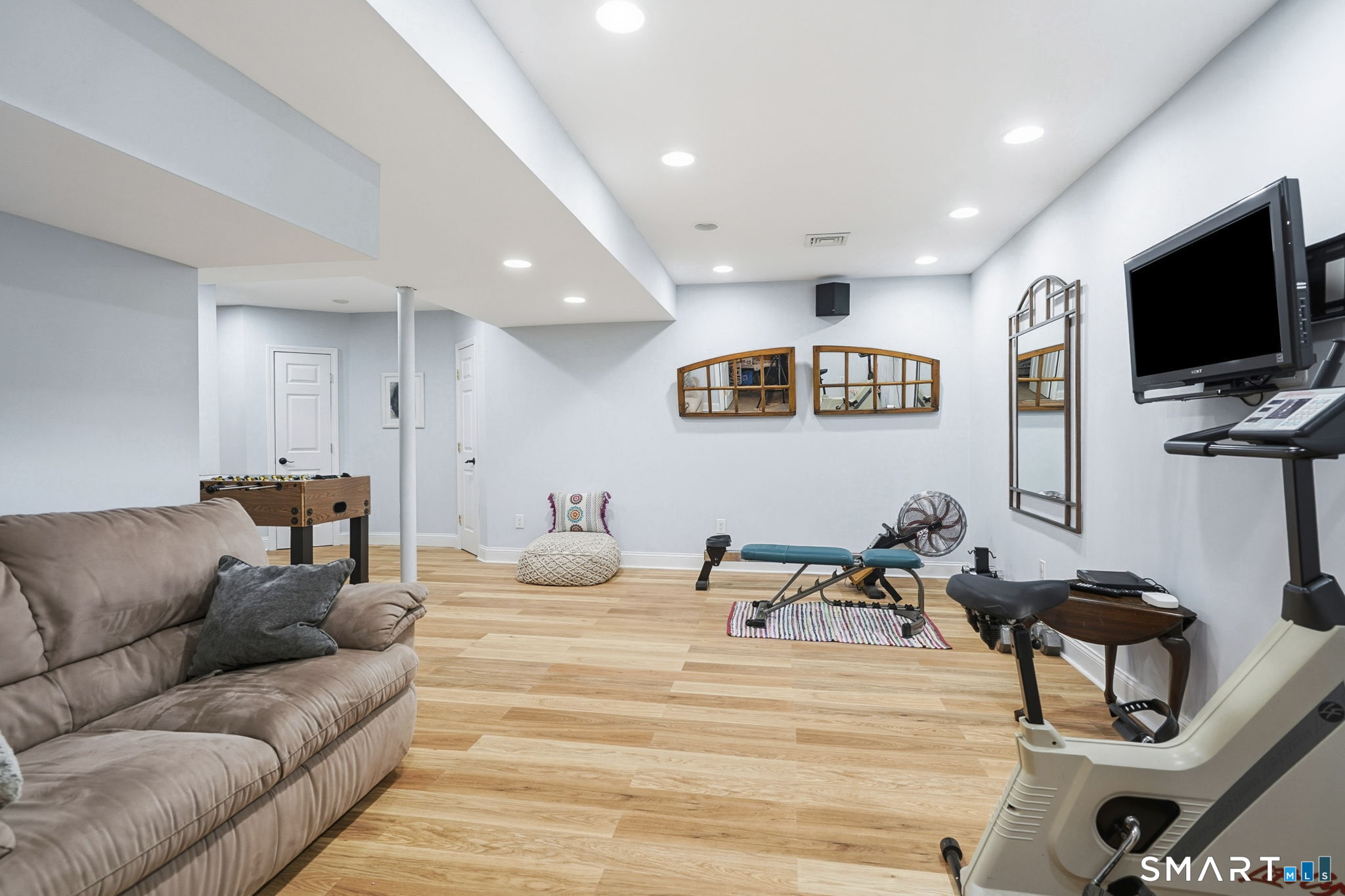 24 Scott Road Oxford, CT 06478 - Photo 26 of 39 a living room with furniture and a flat screen tv