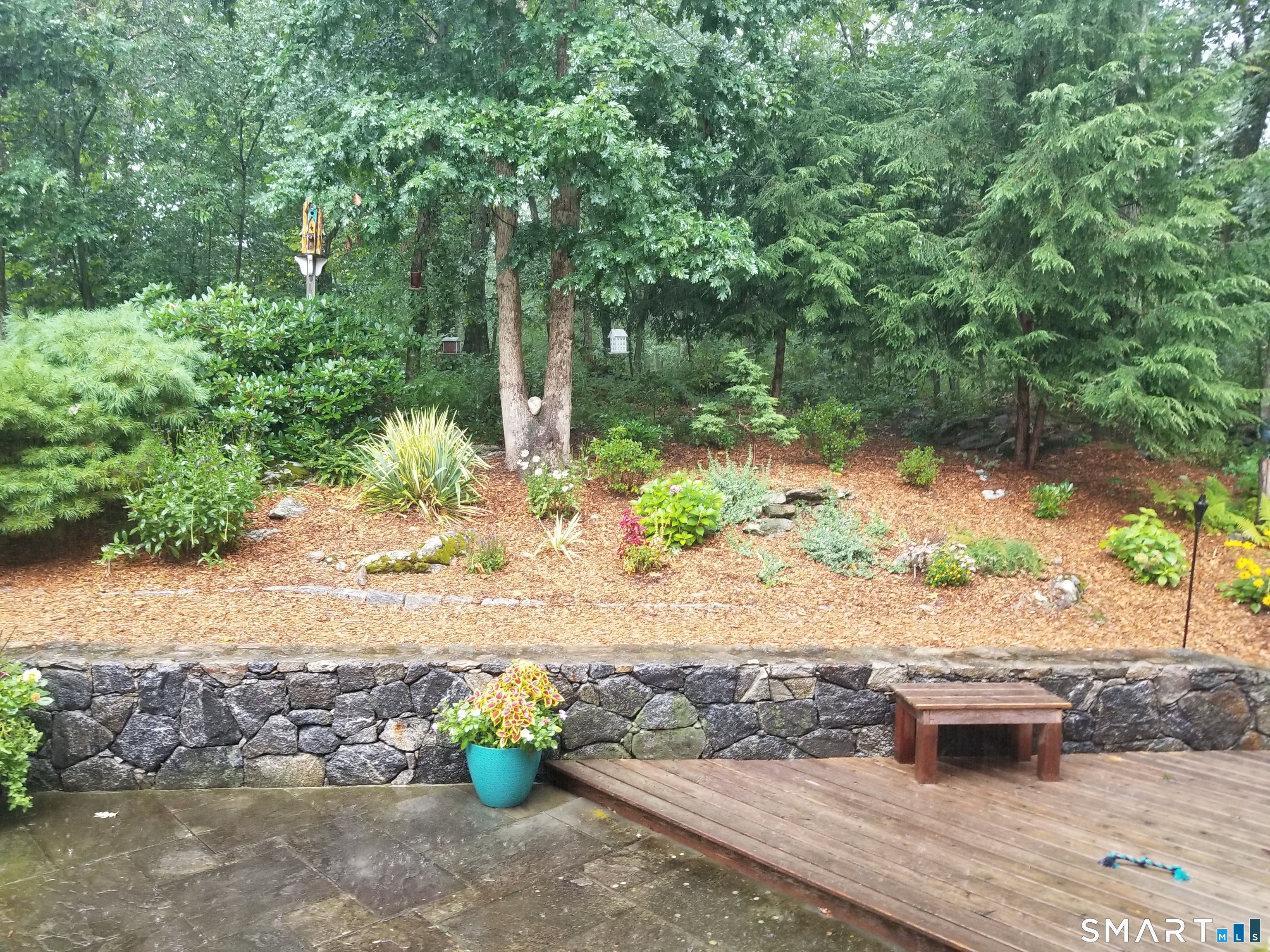 24 Scott Road Oxford, CT 06478 - Photo 36 of 39 a street view with a bench