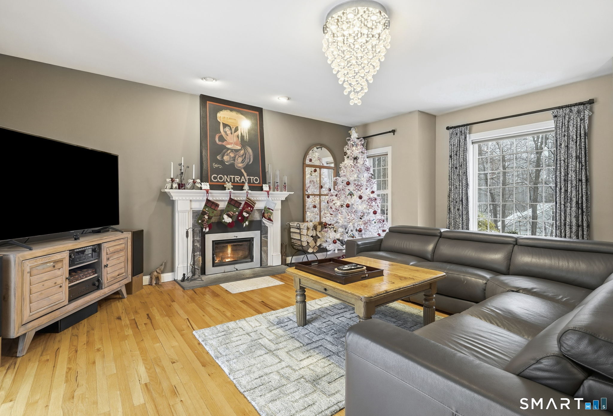 24 Scott Road Oxford, CT 06478 - Photo 5 of 39 a living room with furniture and a flat screen tv