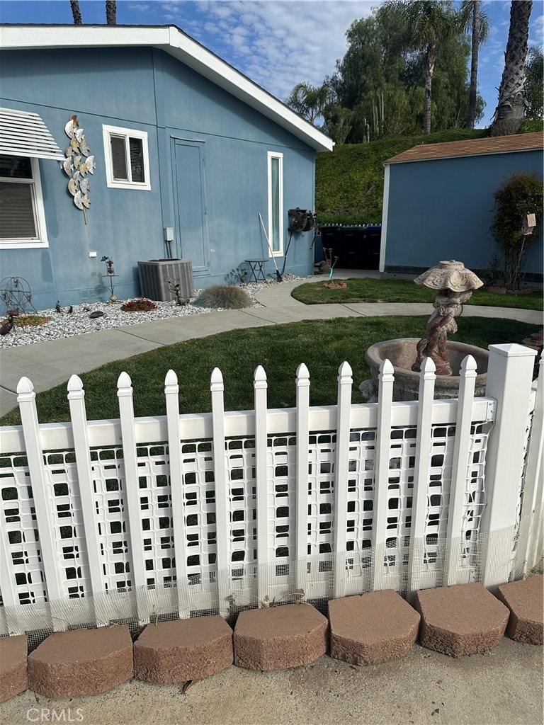 38641 Via Azul Murrieta, CA 92563 - Photo 13 of 18 a front view of building with yard