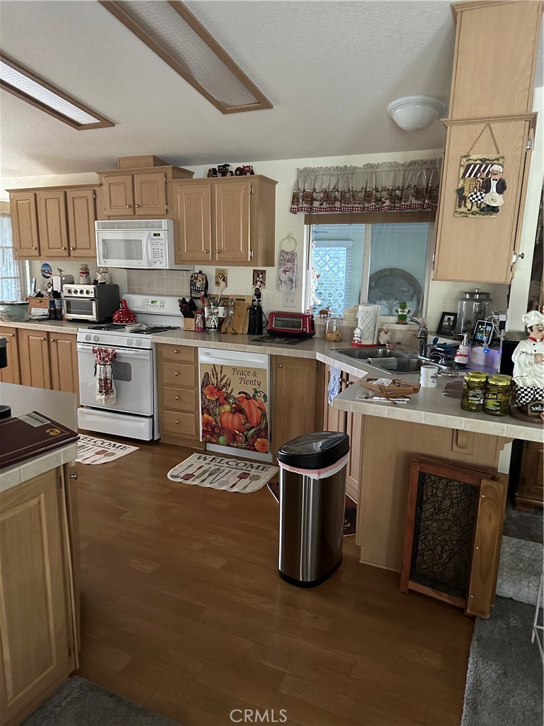 38641 Via Azul Murrieta, CA 92563 - Photo 5 of 18 a kitchen with a sink cabinets and appliances