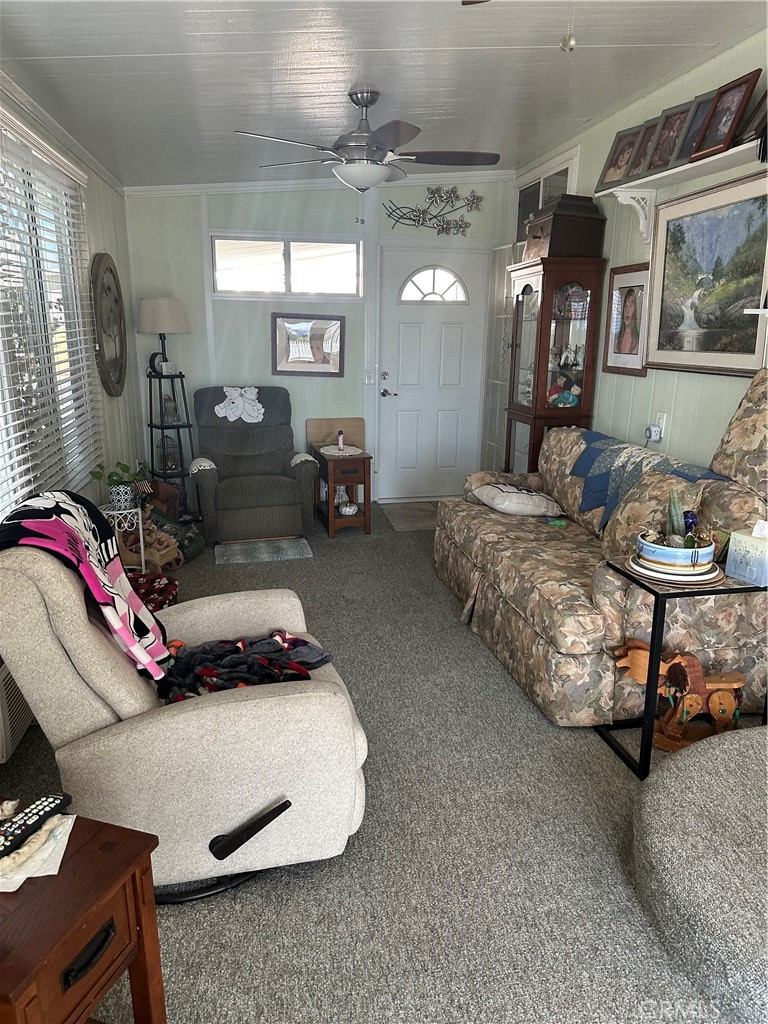 38641 Via Azul Murrieta, CA 92563 - Photo 9 of 18 a living room with furniture and a chandelier