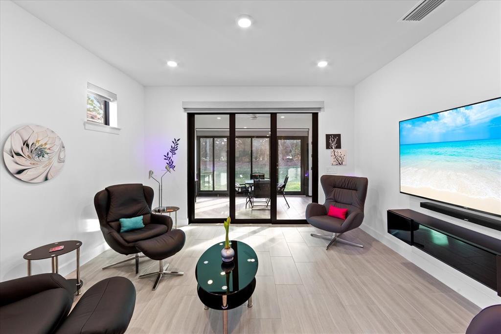 6713 Alstead Circle Lakewood Ranch, FL 34202 - Photo 14 of 86 a living room with furniture and a flat screen tv
