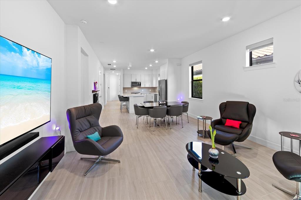 6713 Alstead Circle Lakewood Ranch, FL 34202 - Photo 17 of 86 a living room with furniture and wooden floor
