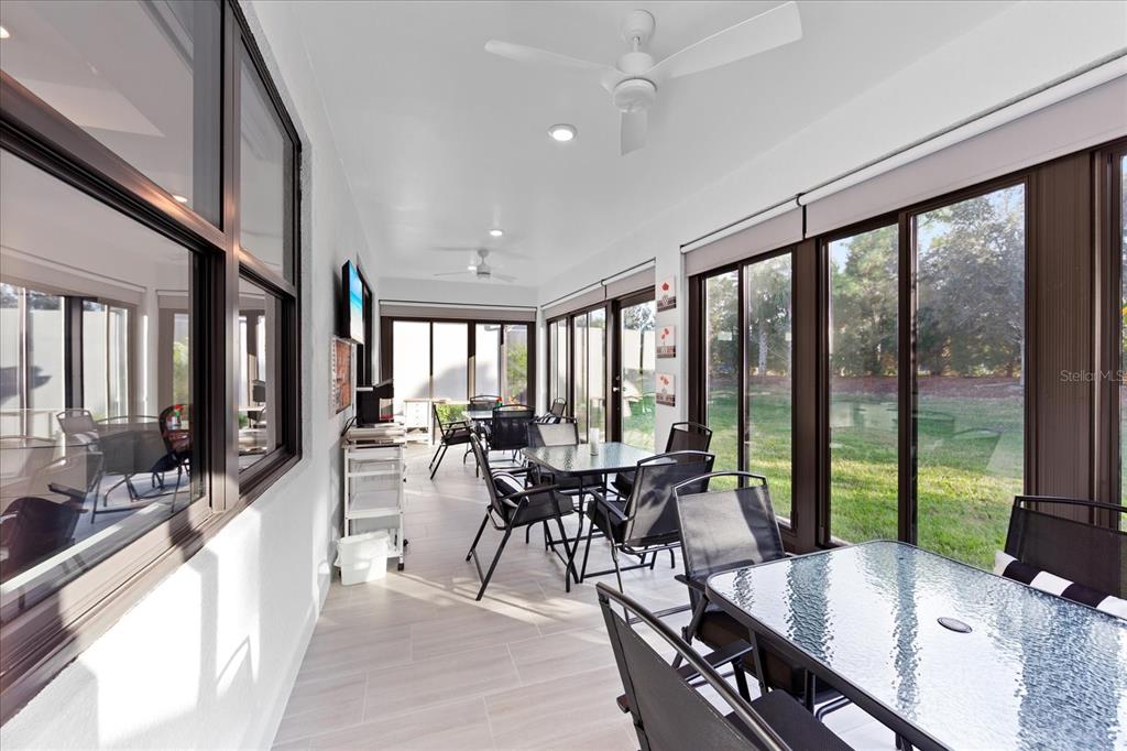 6713 Alstead Circle Lakewood Ranch, FL 34202 - Photo 22 of 86 a view of a dining room with furniture window and outdoor view