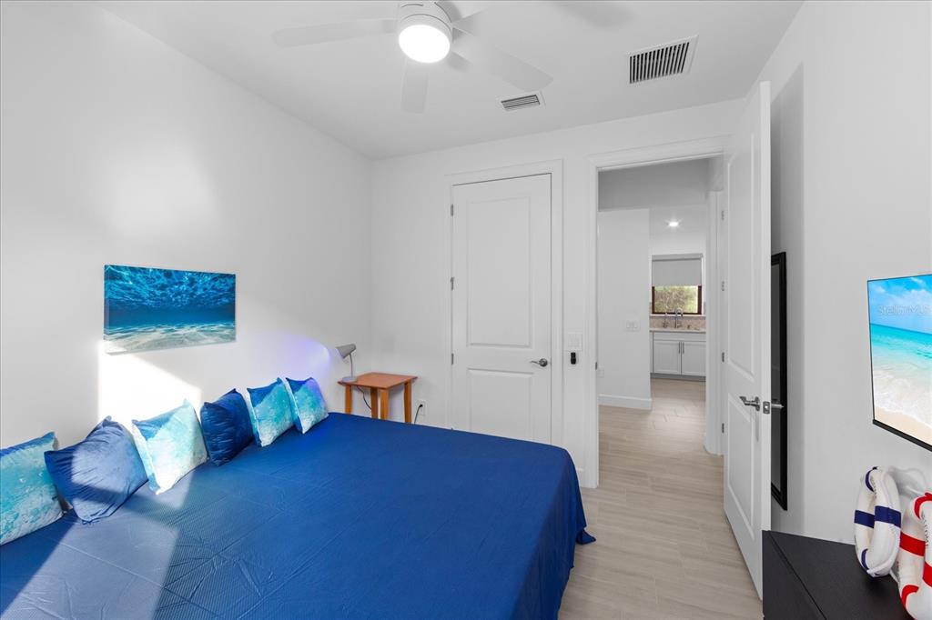 6713 Alstead Circle Lakewood Ranch, FL 34202 - Photo 34 of 86 a bedroom with furniture and a wooden floor