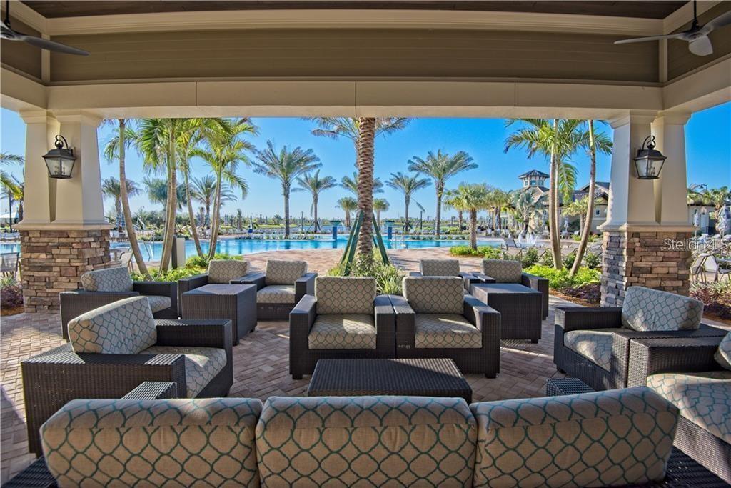 6713 Alstead Circle Lakewood Ranch, FL 34202 - Photo 61 of 86 a living room with fireplace furniture and a large window