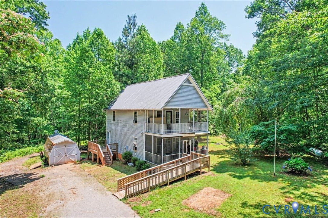 62 The Fls Road Victoria, VA 23974 - Photo 2 of 36 Two-story home featuring a metal roof, screened po