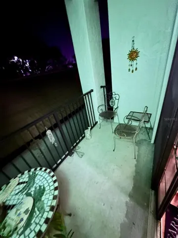 a view of balcony with furniture