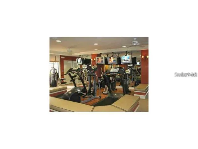 a picture of a living room with a sink and a mirror