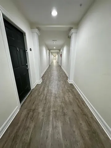 a view of entryway with wooden floor