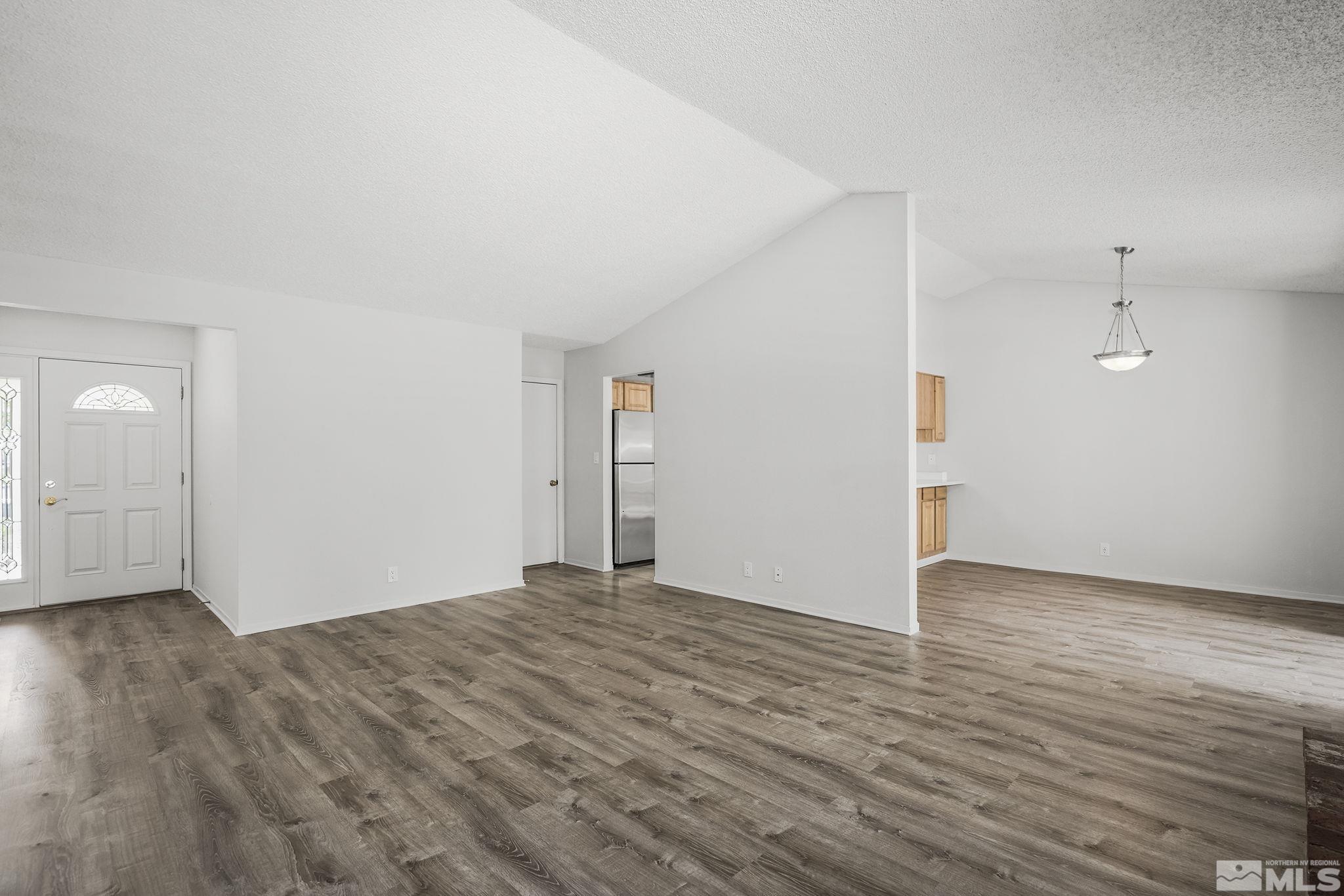 2560 Keystone Avenue Reno, NV 89503 - Photo 3 of 18 an empty room with wooden floor and windows