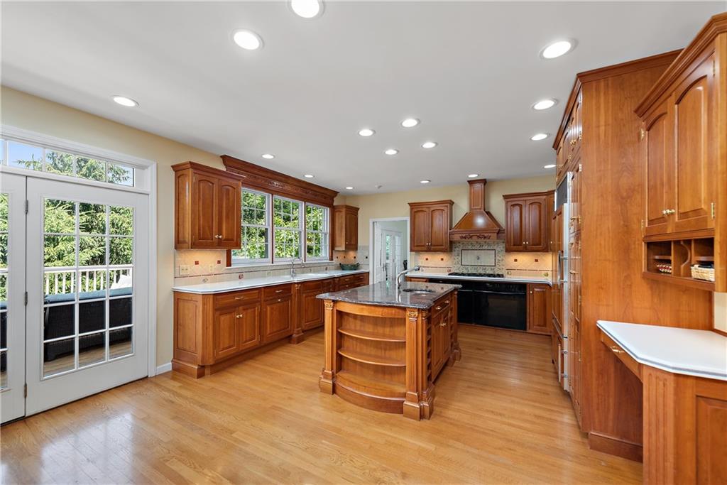 759 Chestnut Road Sewickley, PA 15143 - Photo 8 of 25 a kitchen with stainless steel appliances granite countertop sink stove top oven and cabinets