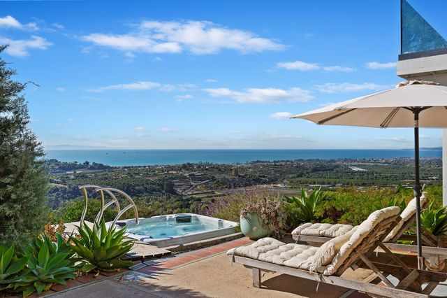 a view of a balcony with lake view and mountain view