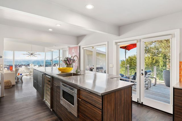 a kitchen with stainless steel appliances granite countertop a stove and a refrigerator