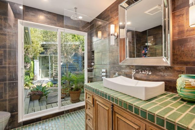 a bathroom with a double vanity sink and a mirror