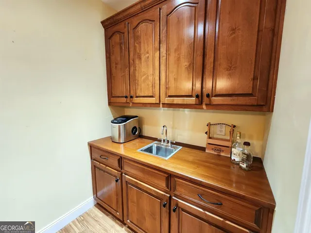 a bathroom with a toilet sink and shower