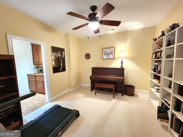 a bed room with a bed and a tv