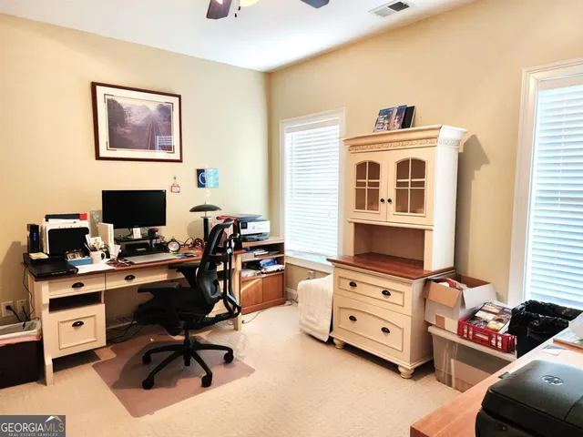 a view of a lake with houses in the back