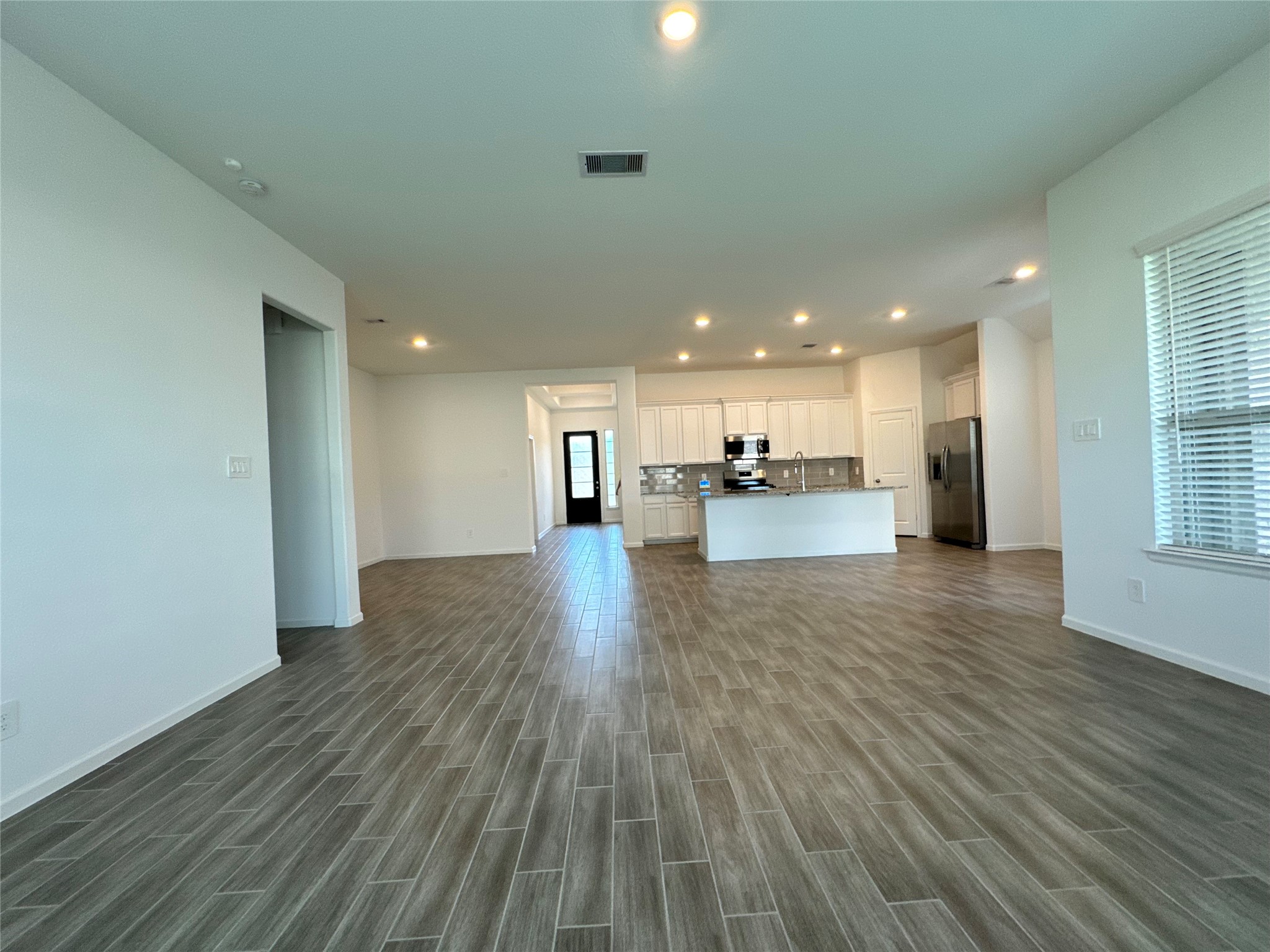 17311 Grand Canyon Road Conroe, TX 77302 - Photo 14 of 28 a view of kitchen with a wooden floor and a kitchen