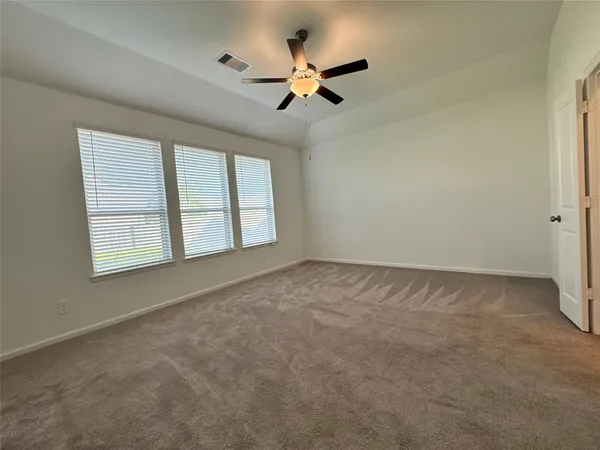 a large bathroom with a double vanity sink and a large mirror