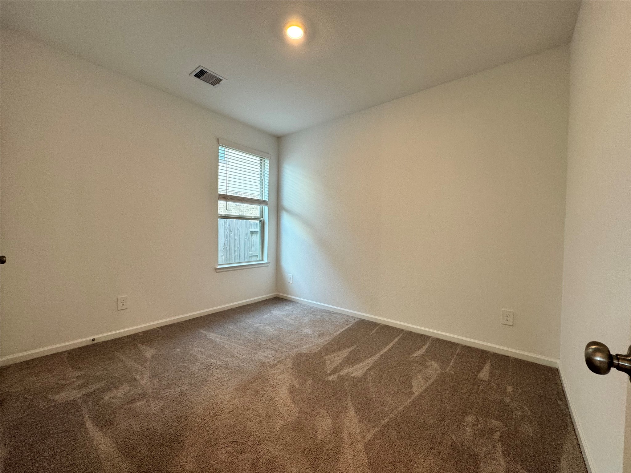 17311 Grand Canyon Road Conroe, TX 77302 - Photo 22 of 28 an empty room with windows