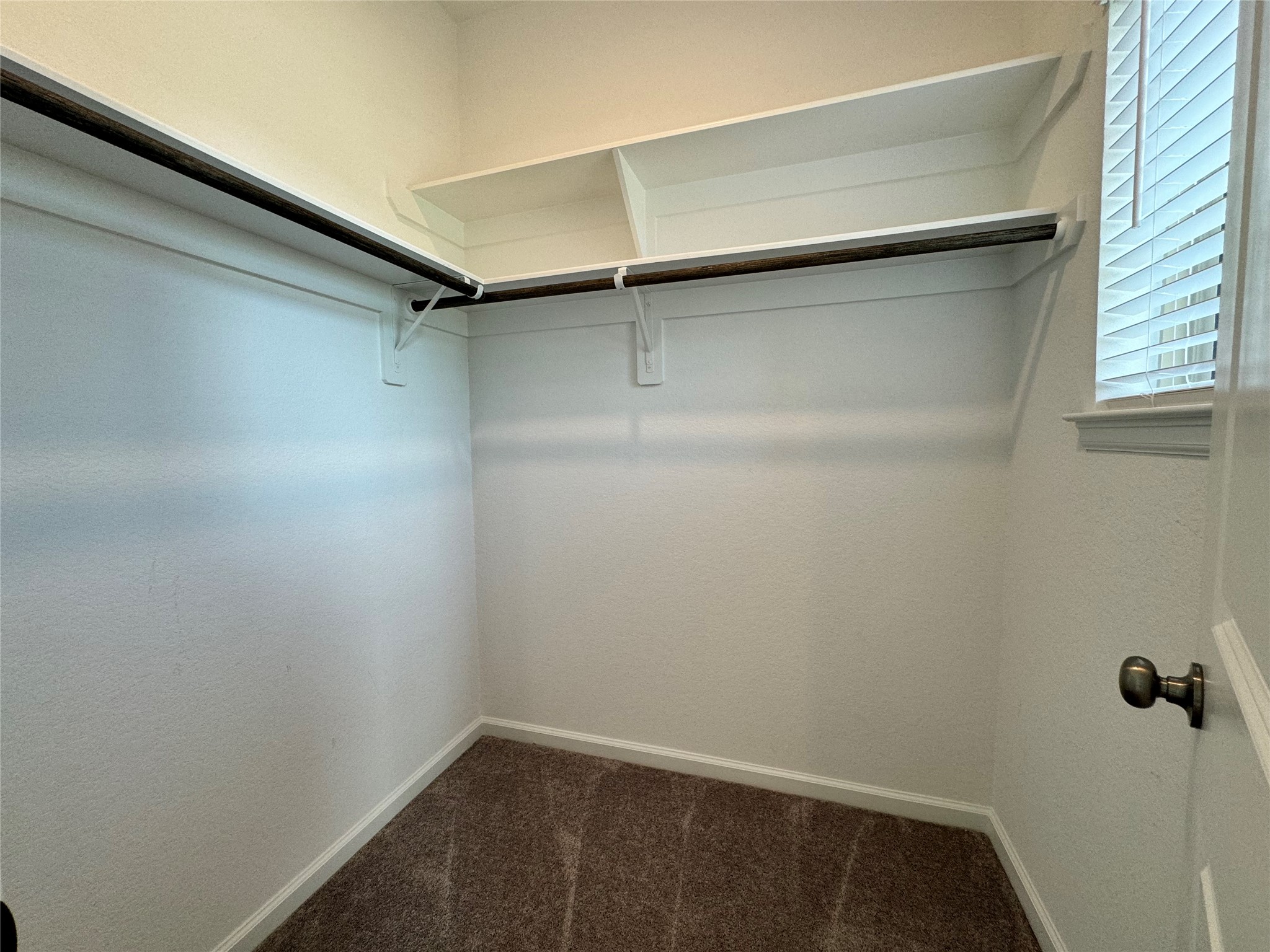 17311 Grand Canyon Road Conroe, TX 77302 - Photo 23 of 28 a view of a room with shelf on the wall