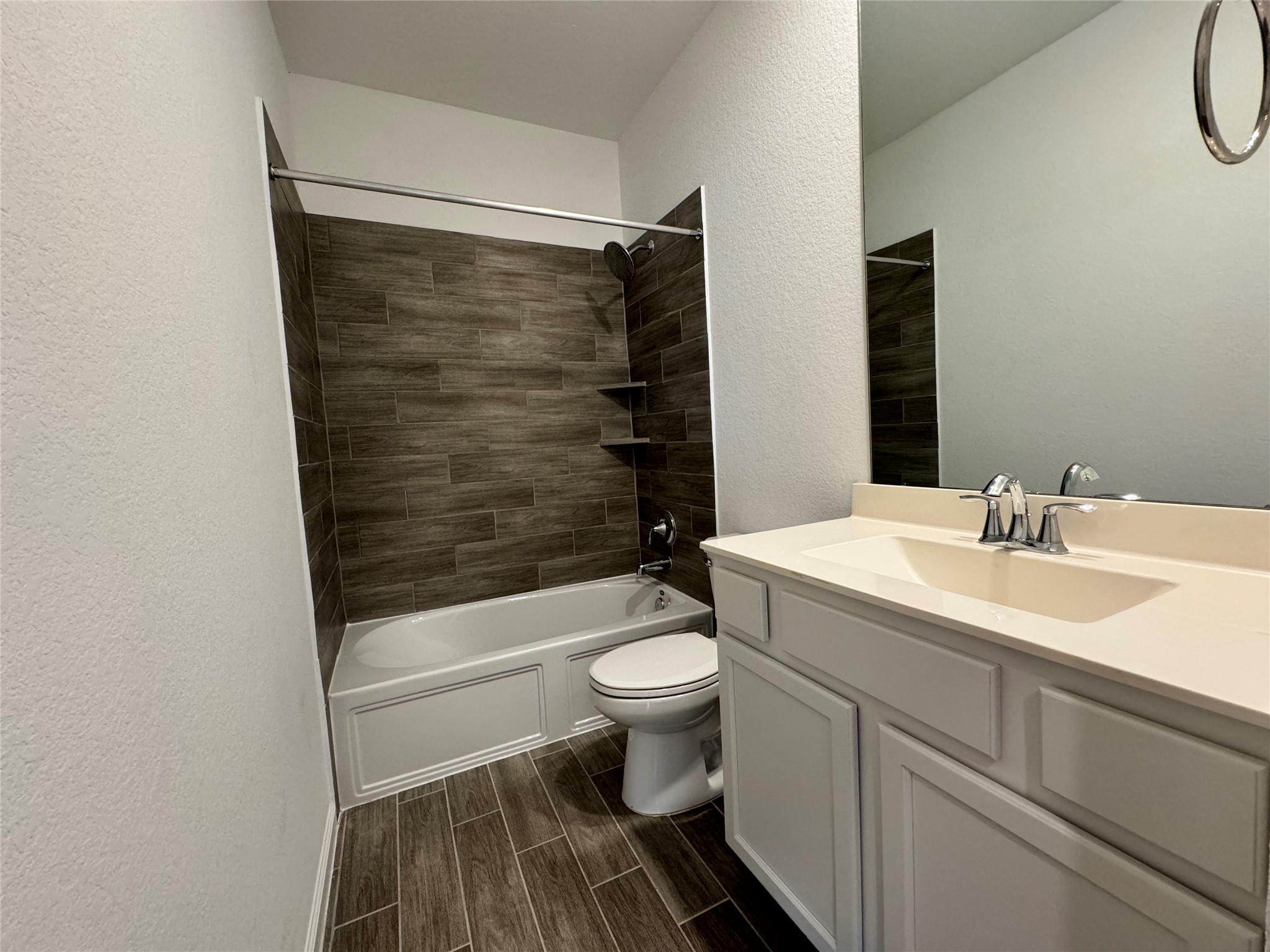 17311 Grand Canyon Road Conroe, TX 77302 - Photo 24 of 28 a bathroom with a sink toilet and shower