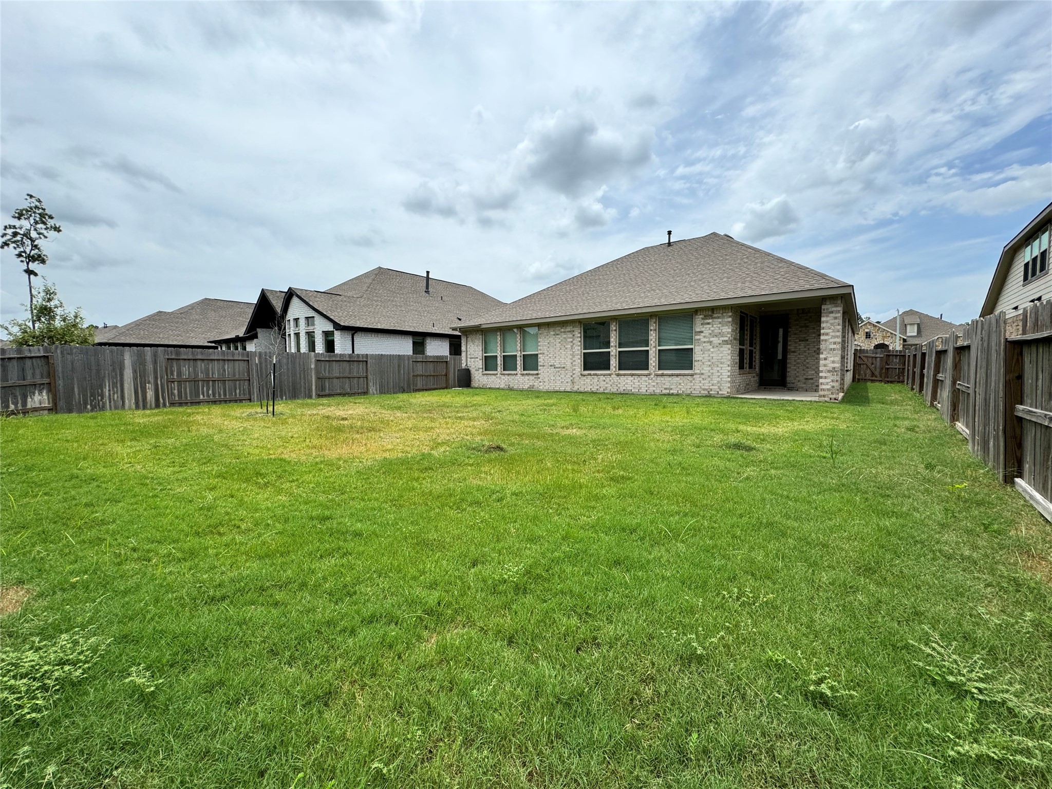 17311 Grand Canyon Road Conroe, TX 77302 - Photo 28 of 28 a front view of a house with a yard