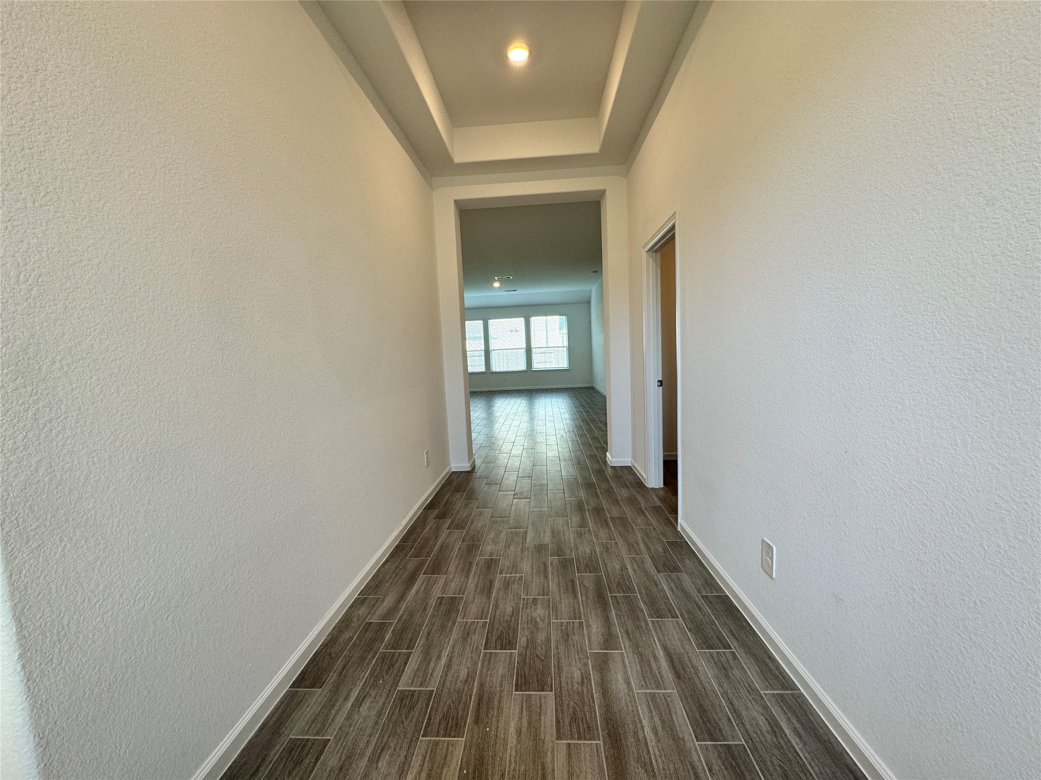 17311 Grand Canyon Road Conroe, TX 77302 - Photo 3 of 28 a view of a hallway with wooden floor