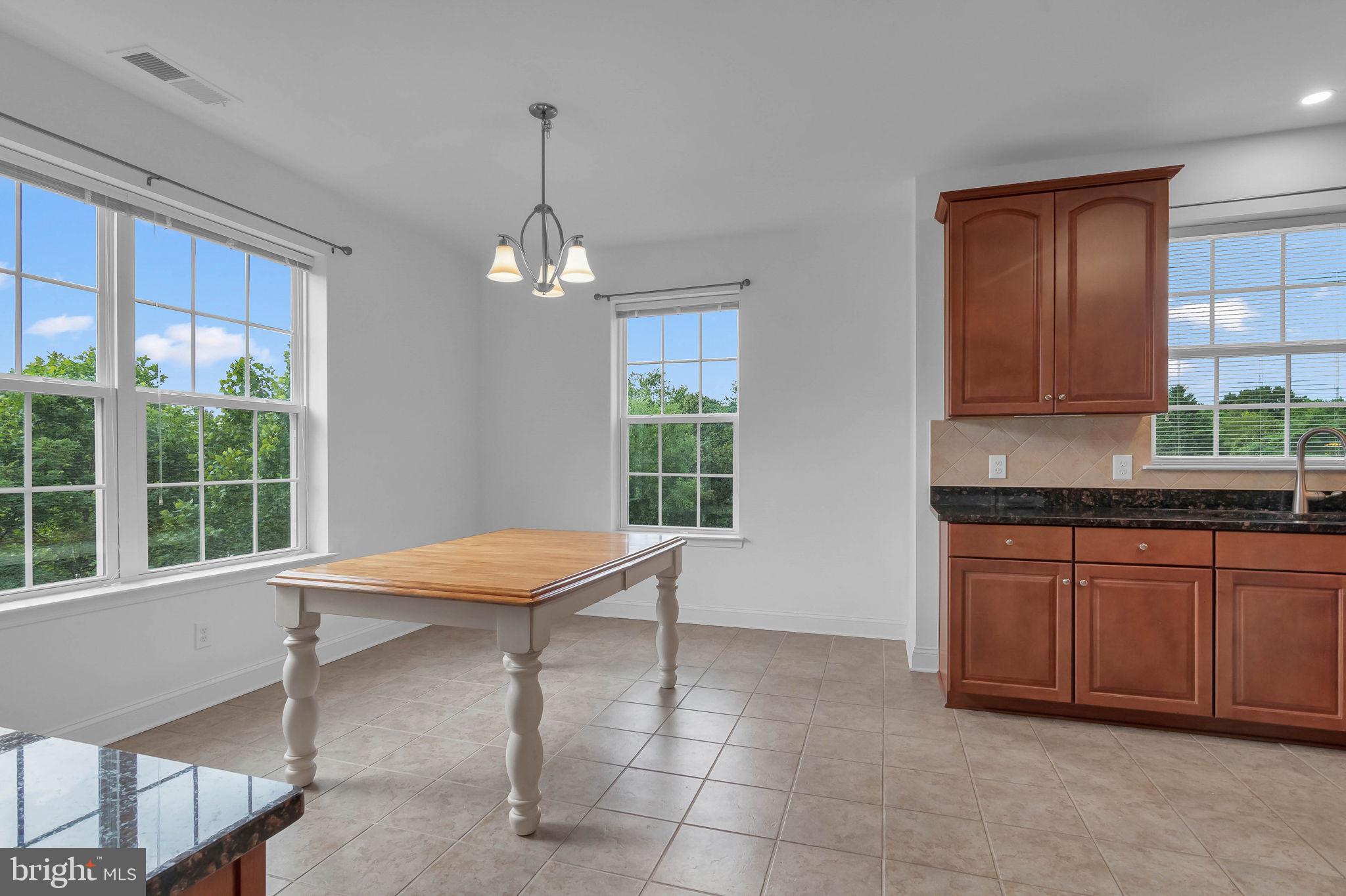 10273A Fountain Circle, Unit 306 Manassas, VA 20110 - Photo 13 of 33 a room with granite countertop furniture and window