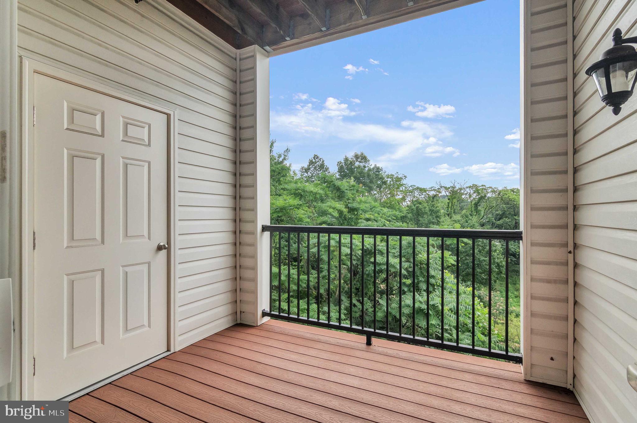 10273A Fountain Circle, Unit 306 Manassas, VA 20110 - Photo 21 of 33 a view of a balcony with wooden floor