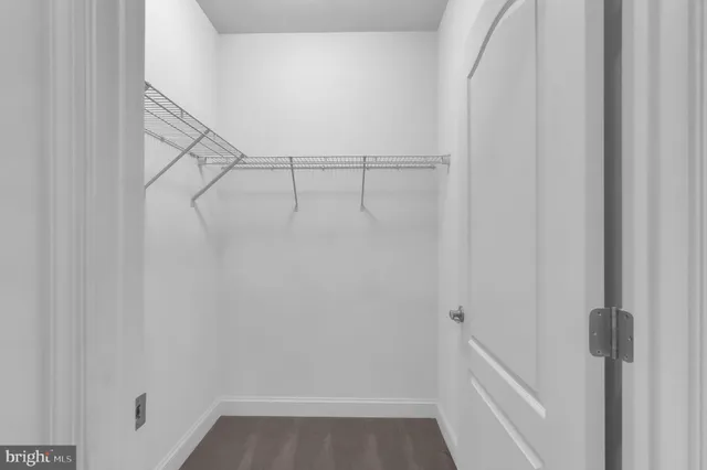 a view of an empty walk in closet