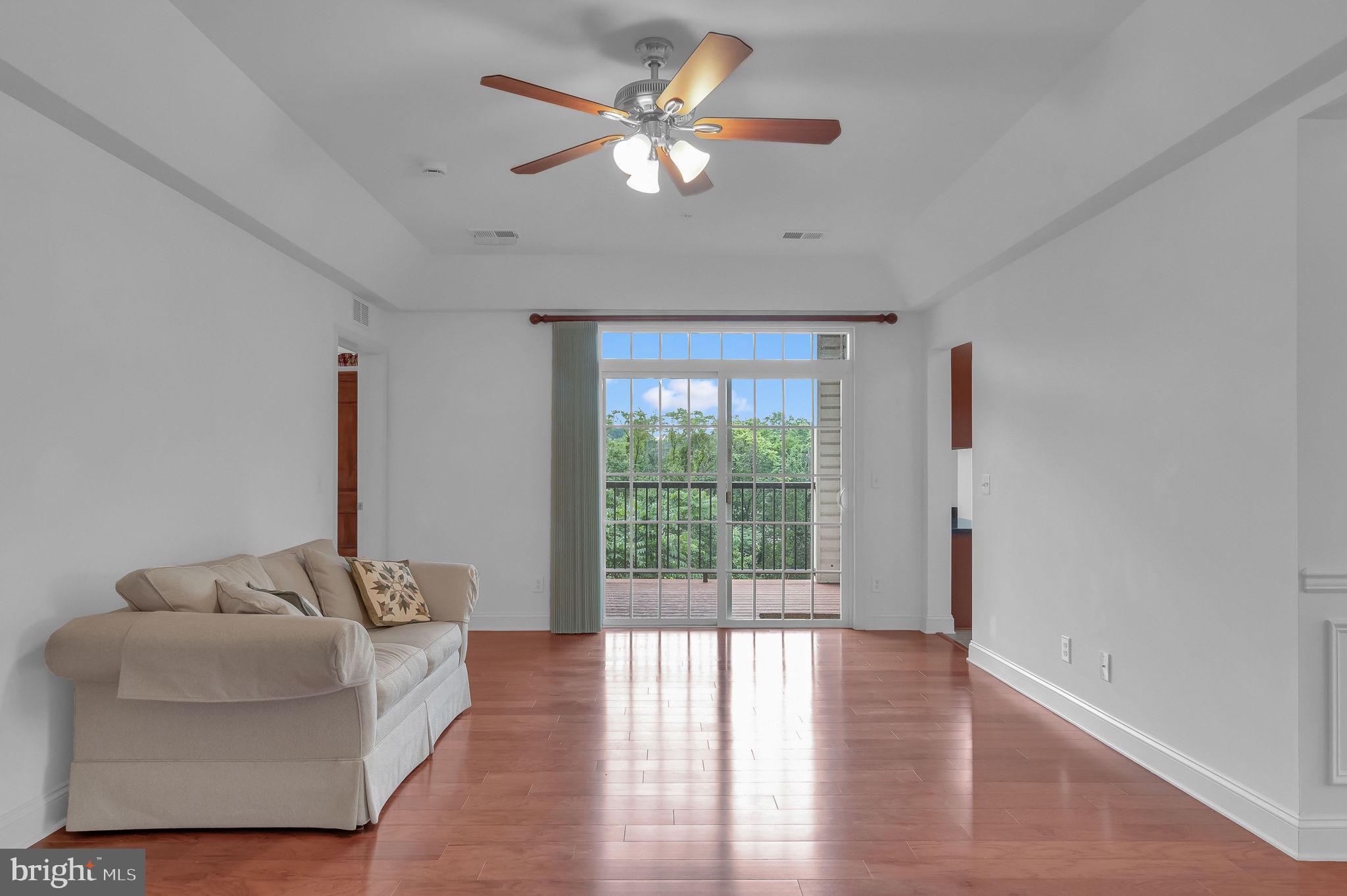 10273A Fountain Circle, Unit 306 Manassas, VA 20110 - Photo 9 of 33 a living room with furniture and a large window