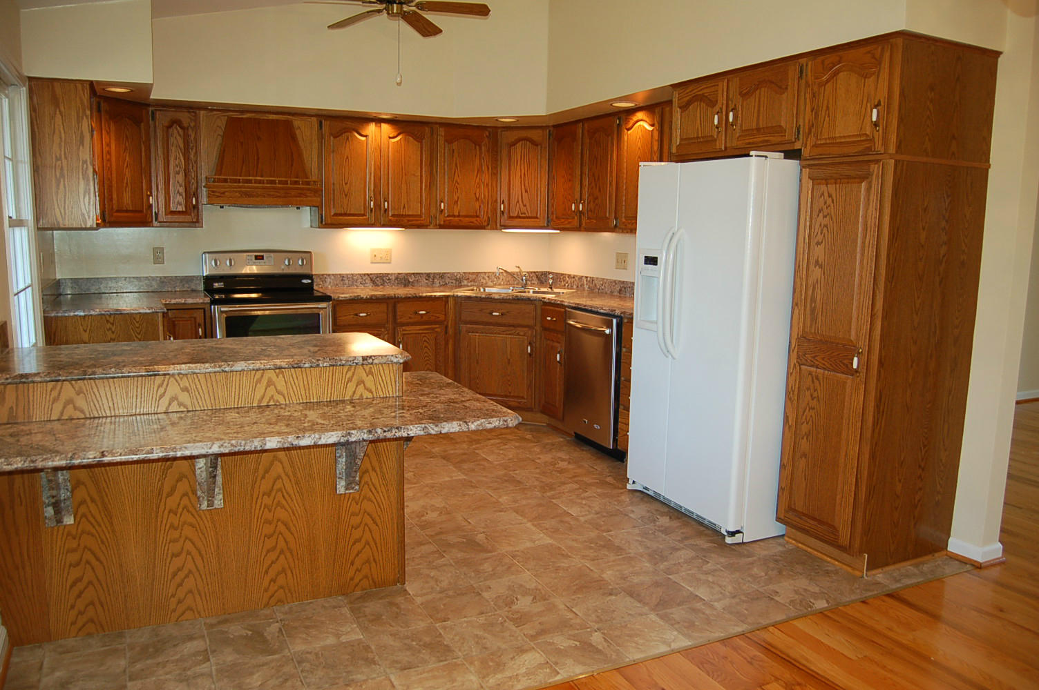 198 Oak Ridge Court Blue Ridge, VA 24064 - Photo 11 of 33 a kitchen with stainless steel appliances granite countertop a refrigerator and a stove