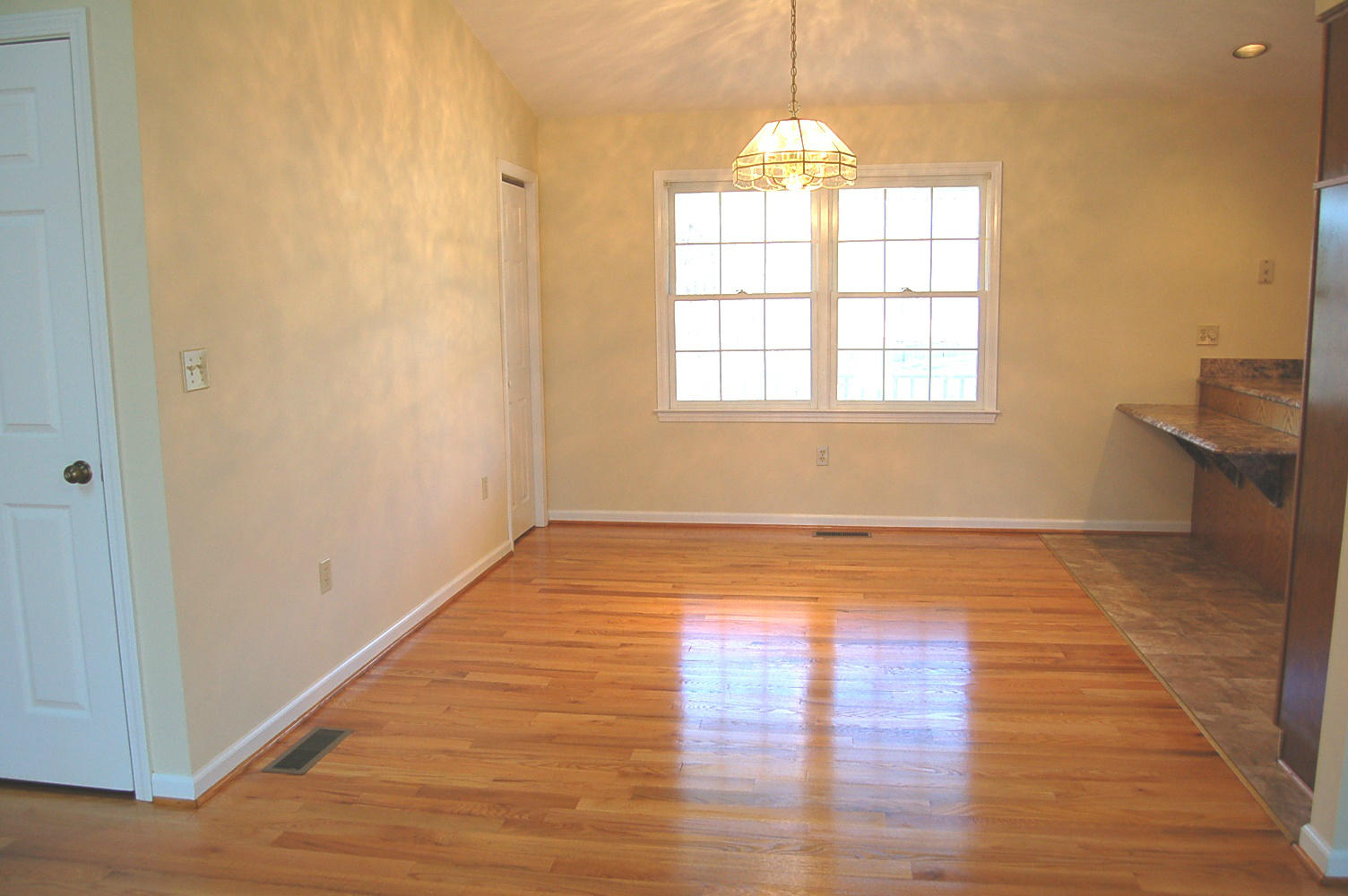 198 Oak Ridge Court Blue Ridge, VA 24064 - Photo 13 of 33 wooden floor in an empty room with a window