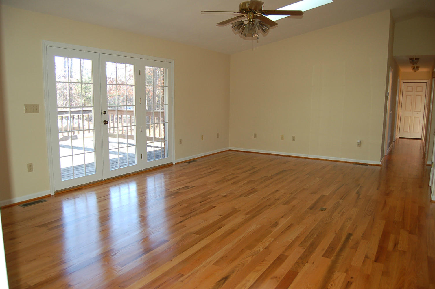 198 Oak Ridge Court Blue Ridge, VA 24064 - Photo 9 of 33 wooden floor in an empty room with a window