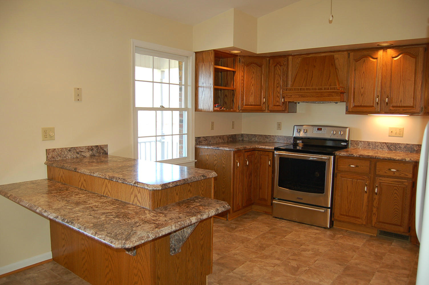 198 Oak Ridge Court Blue Ridge, VA 24064 - Photo 10 of 33 a kitchen with stainless steel appliances granite countertop a stove a sink and a microwave