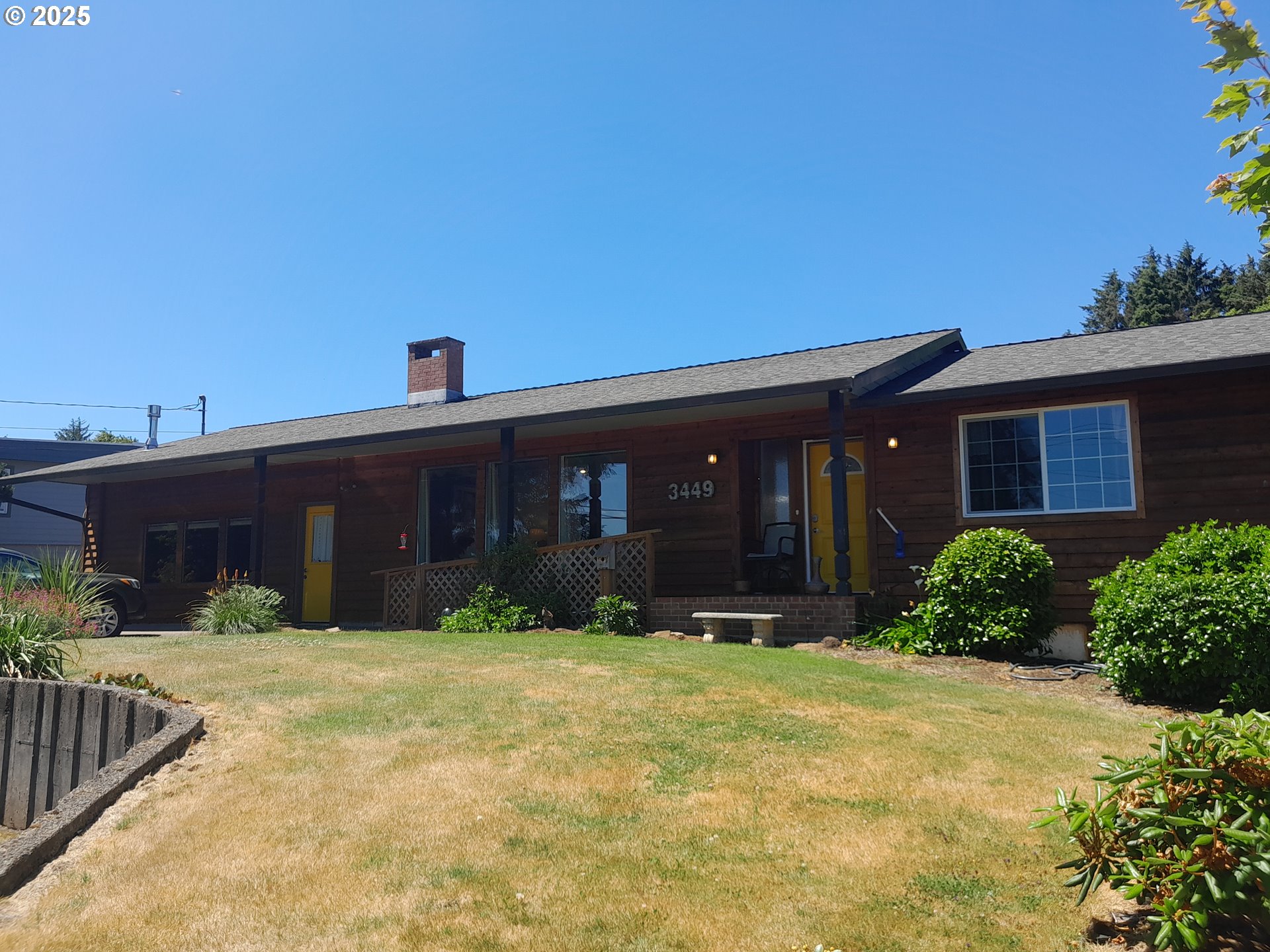 3449 Northeast West Devils Lake Road Lincoln City, OR 97367 - Photo 1 of 48 a view of a house with a yard