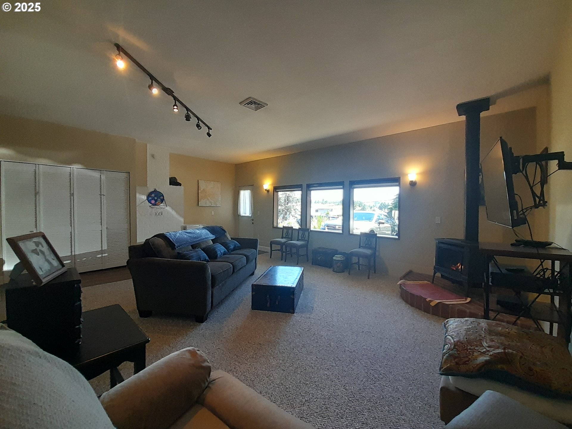 3449 Northeast West Devils Lake Road Lincoln City, OR 97367 - Photo 13 of 48 a living room with furniture and a window