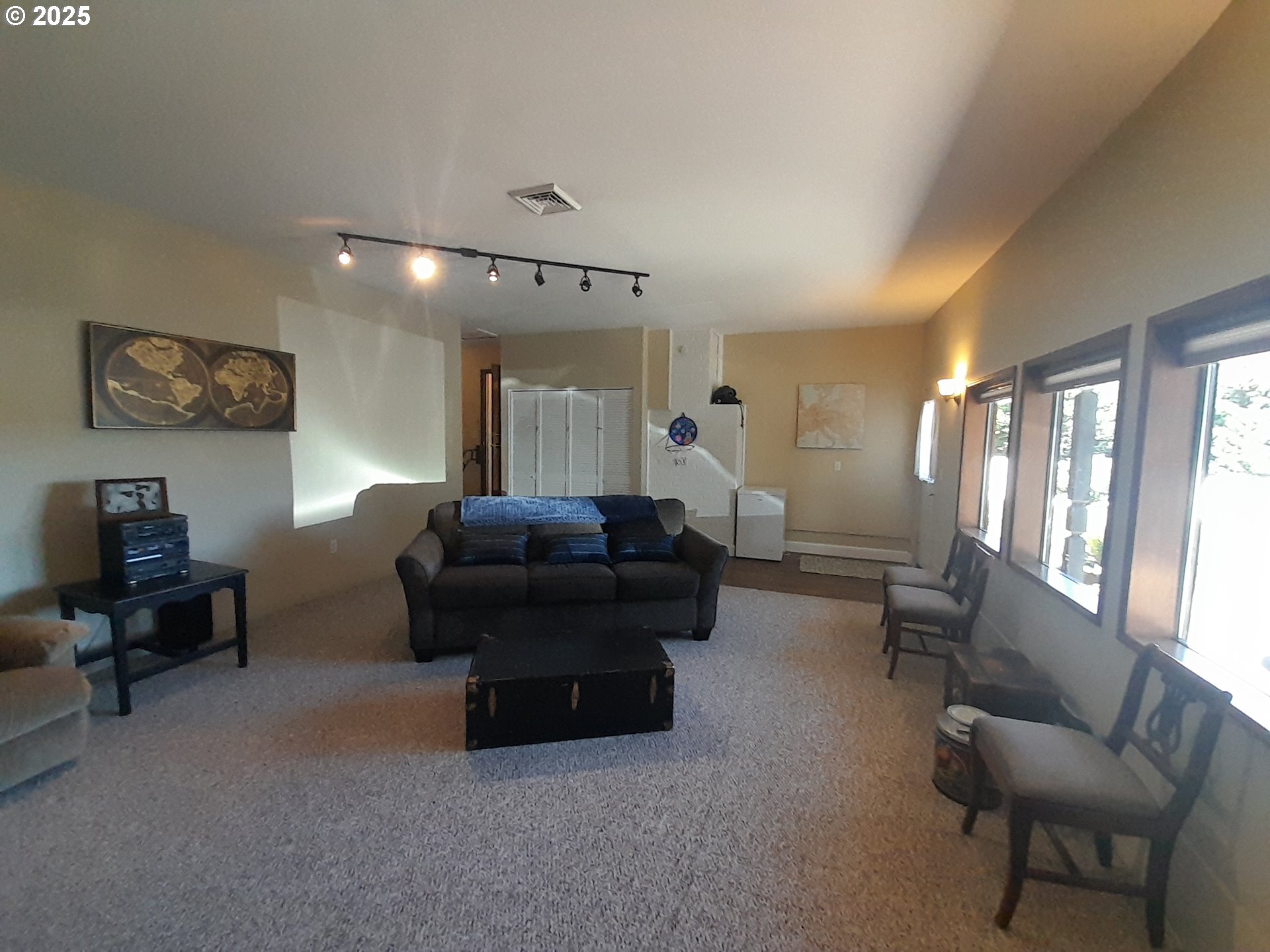 3449 Northeast West Devils Lake Road Lincoln City, OR 97367 - Photo 15 of 48 a living room with furniture and a large window