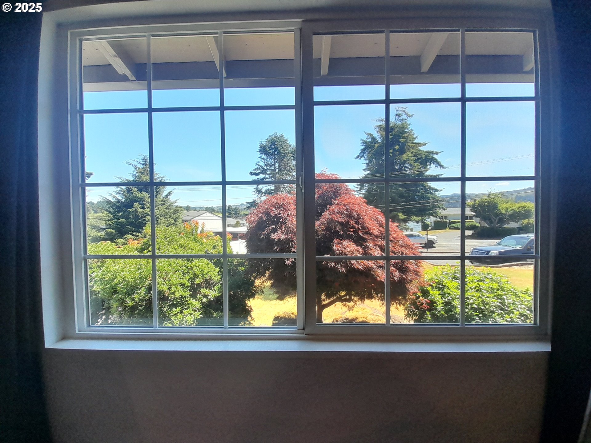 3449 Northeast West Devils Lake Road Lincoln City, OR 97367 - Photo 19 of 48 a view of a glass door with a yard