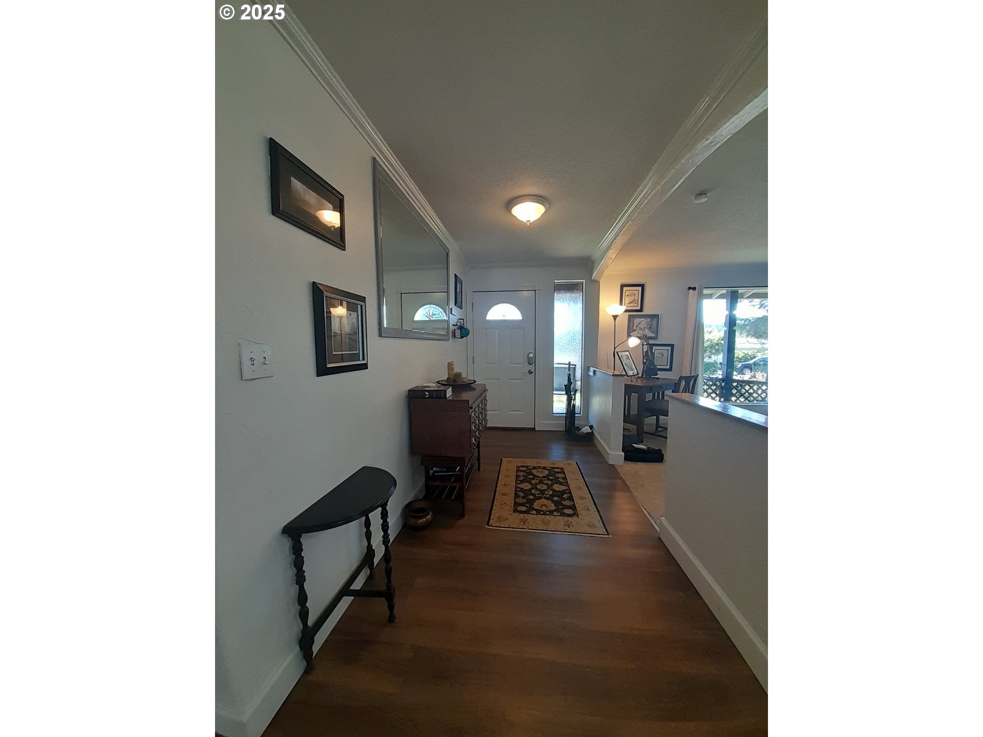 3449 Northeast West Devils Lake Road Lincoln City, OR 97367 - Photo 2 of 48 a view of a hallway with a large window