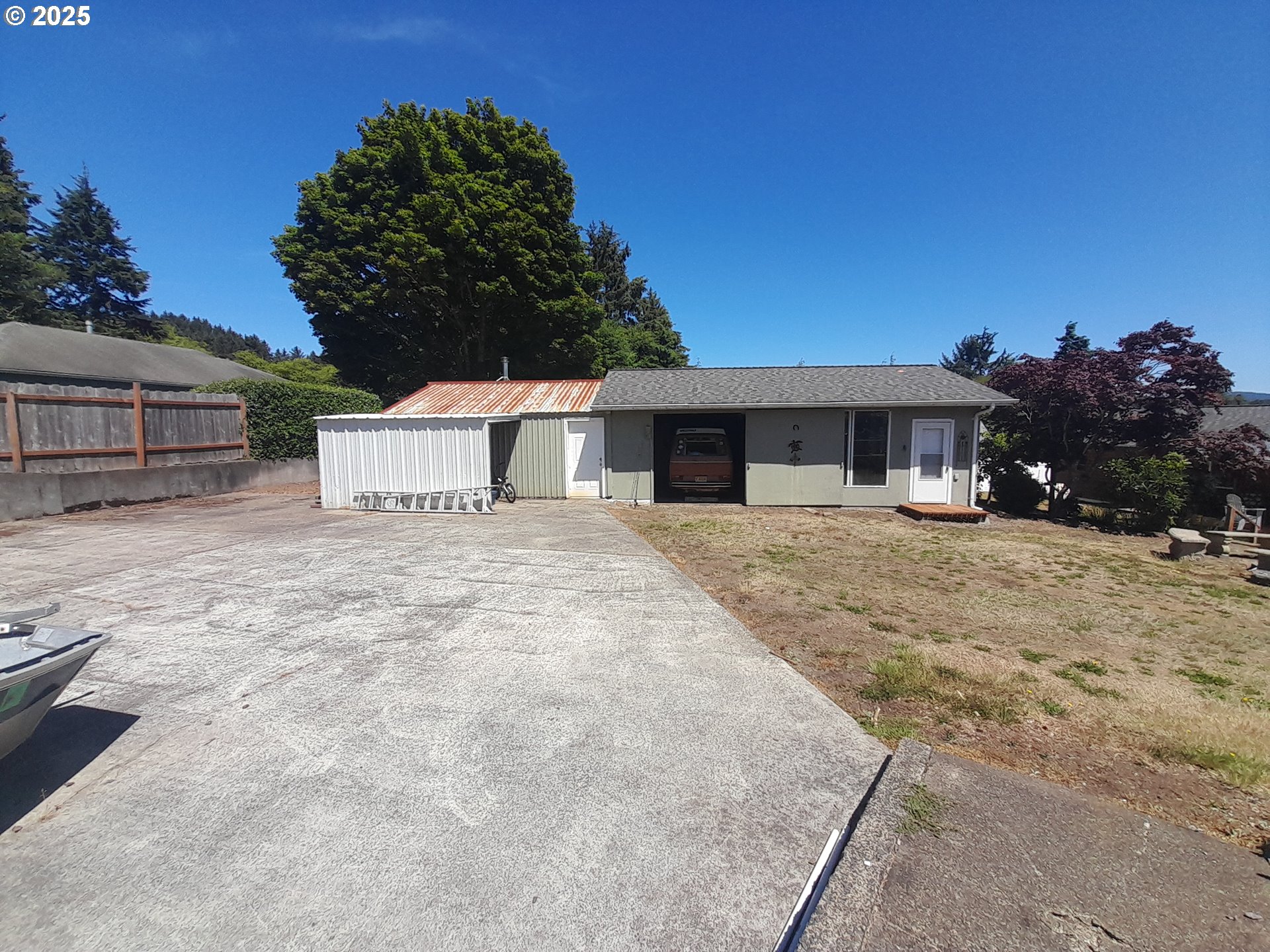 3449 Northeast West Devils Lake Road Lincoln City, OR 97367 - Photo 36 of 48 a front view of a house with a yard