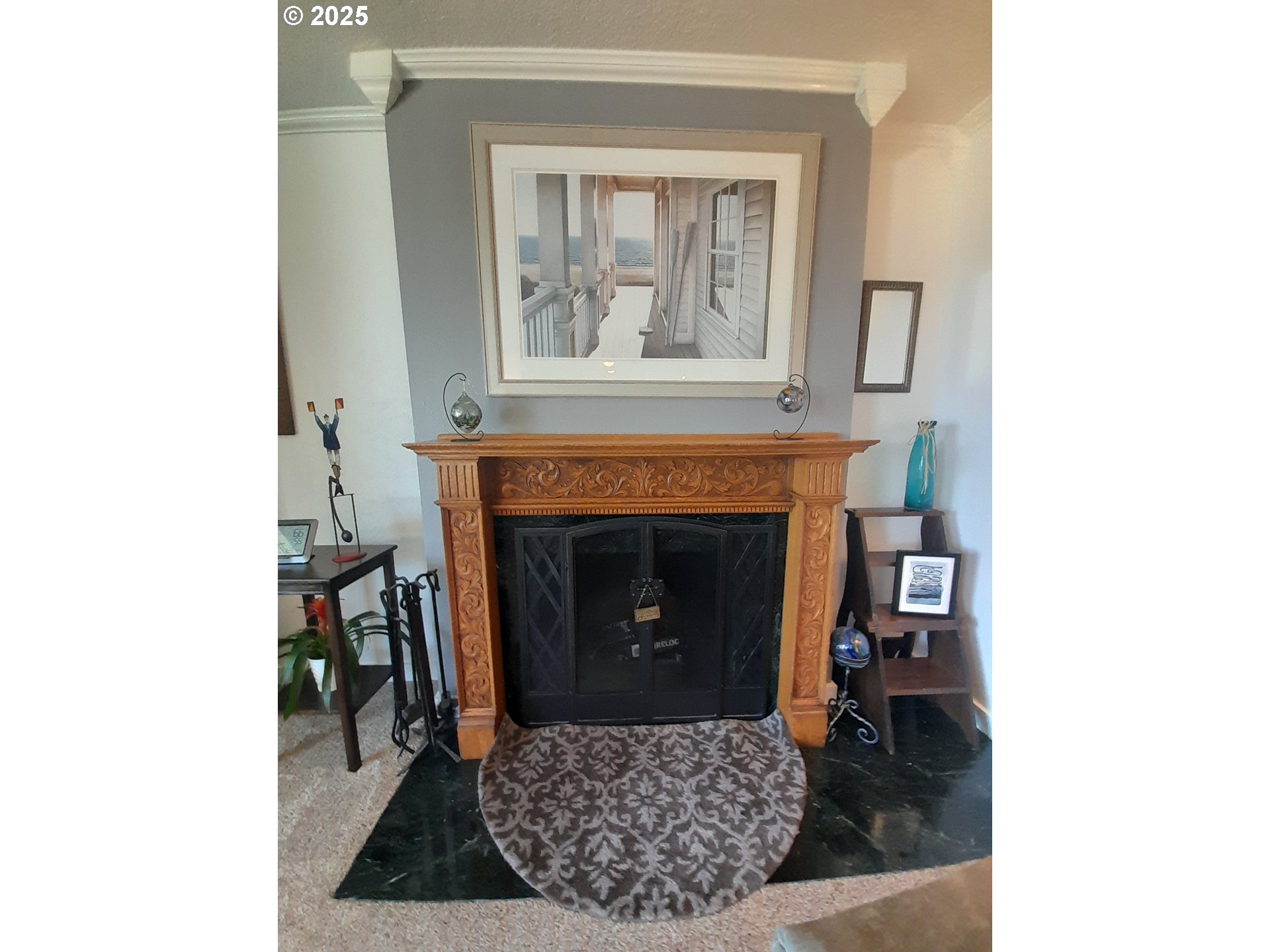 3449 Northeast West Devils Lake Road Lincoln City, OR 97367 - Photo 5 of 48 a living room with furniture and a fireplace