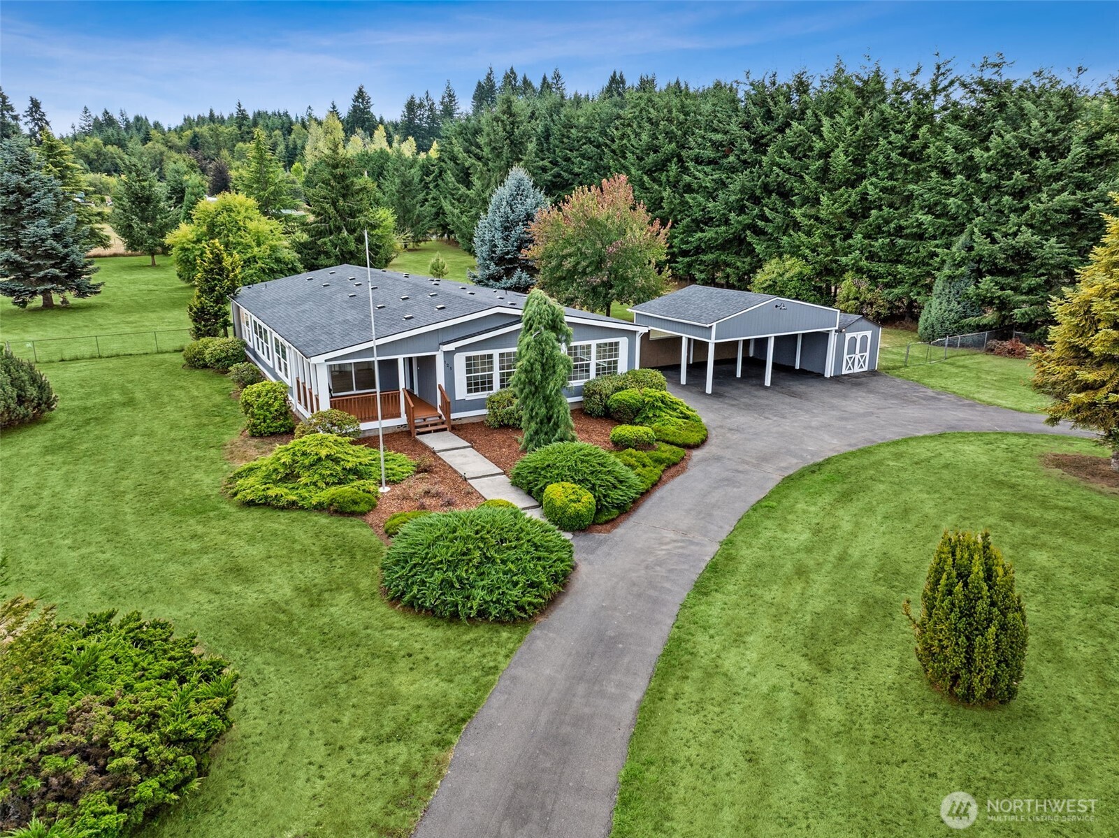 125 Highland Road Winlock, WA 98596 - Photo 1 of 40 an aerial view of a house with garden space and trees