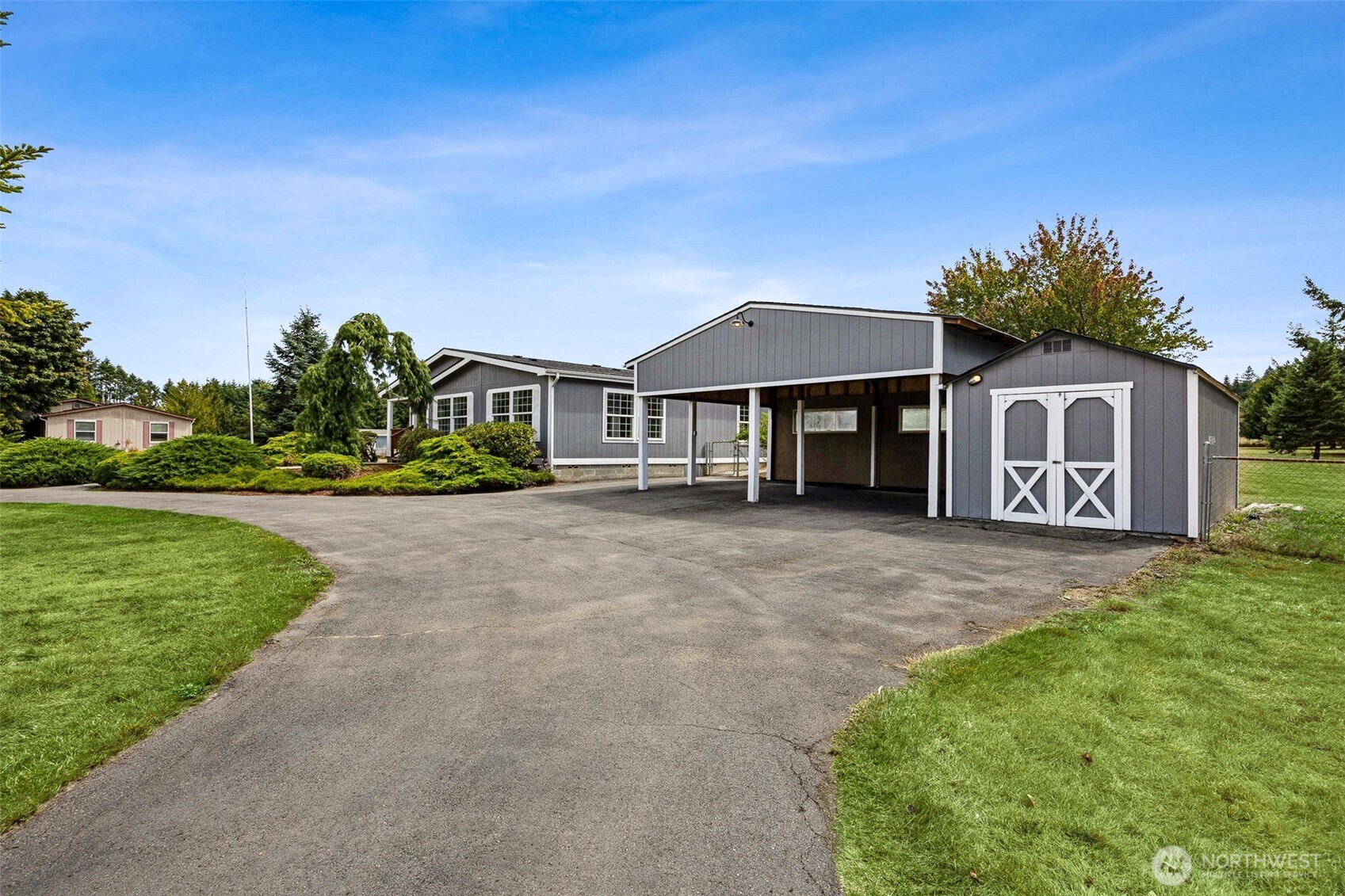 125 Highland Road Winlock, WA 98596 - Photo 29 of 40 a front view of a house with a yard and garage