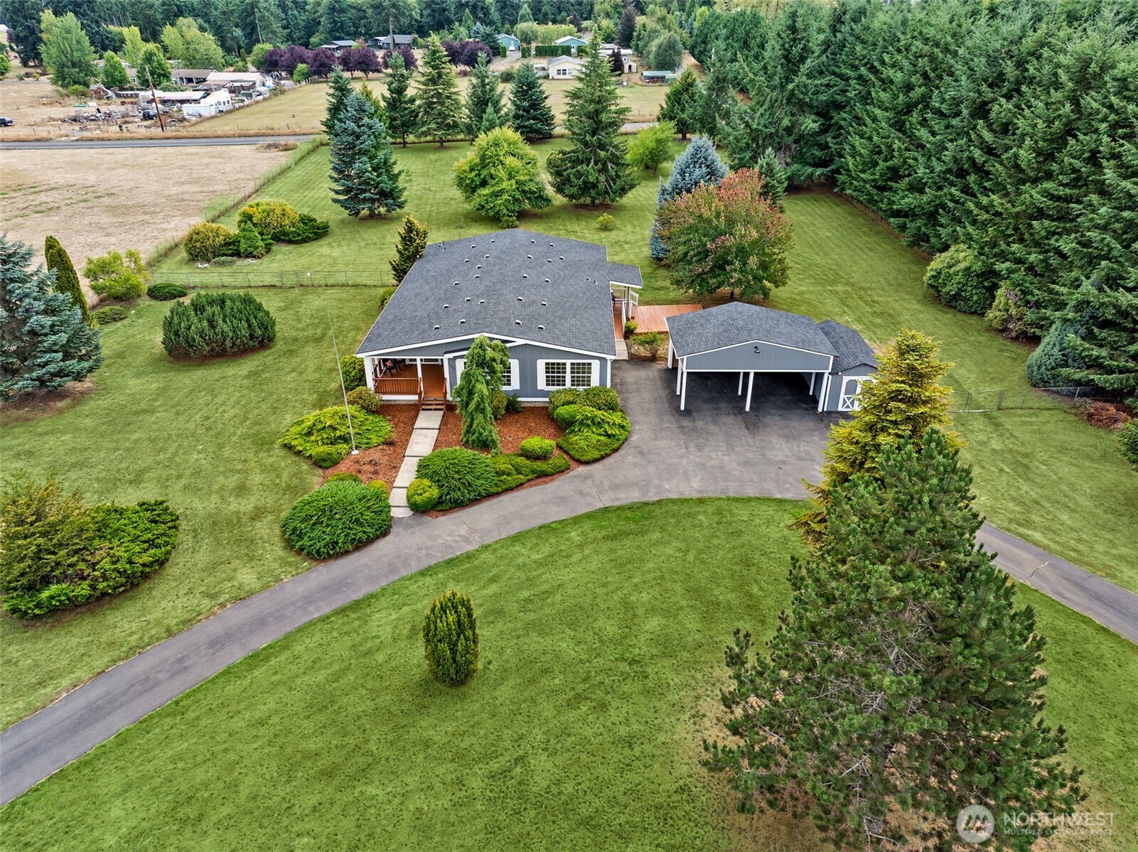 125 Highland Road Winlock, WA 98596 - Photo 36 of 40 an aerial view of residential houses with outdoor space and trees